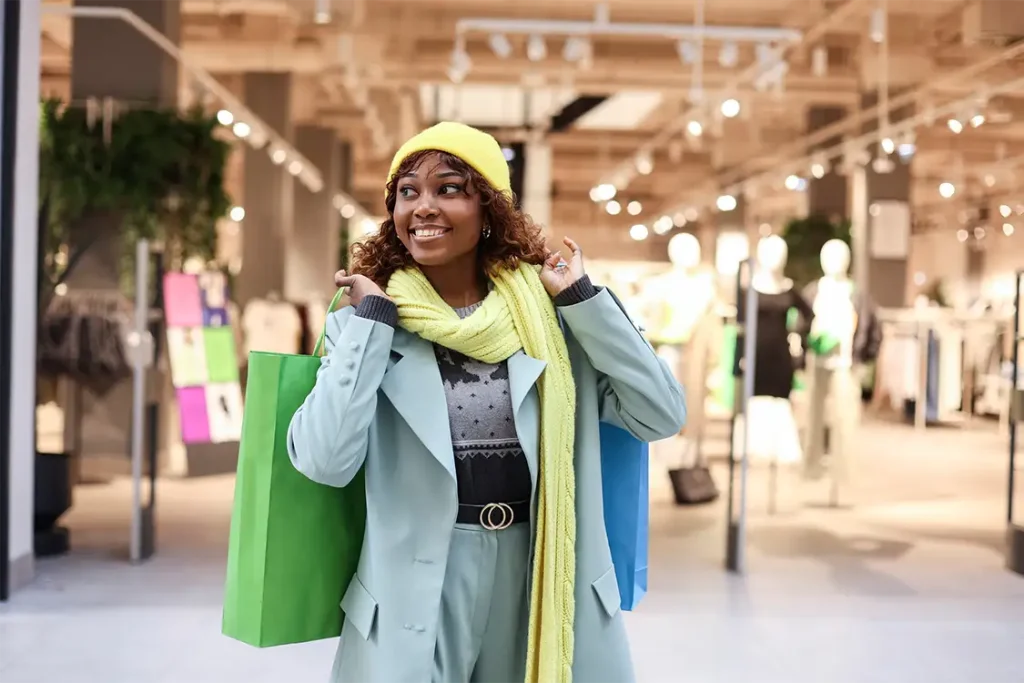 A woman with shopping bags at the mall